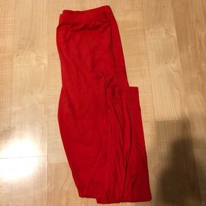 Reddish orange leggings